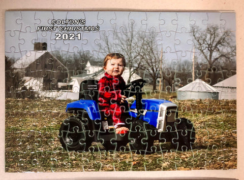 Custom jigsaw puzzle with a baby riding a tractor