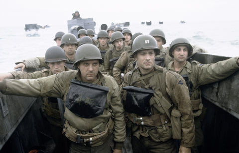 Saving Private Ryan - a movie showing Soldiers riding on a boat headed towards D-Day. 