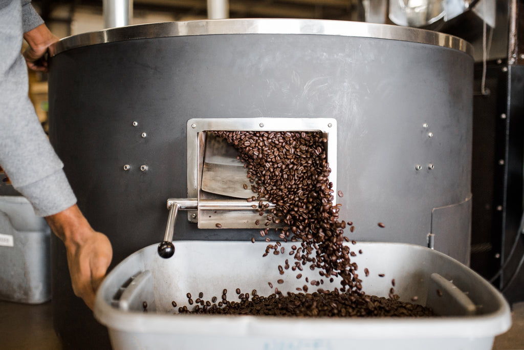 Coffee beans coming out of roaster