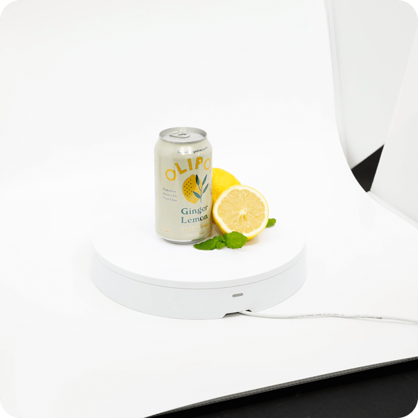 Ginger lemon beverage with lemons on Foldio360 Smart Turntable