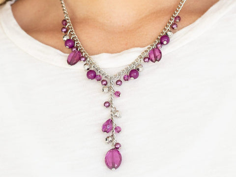 pendant necklace with glass like purple beads