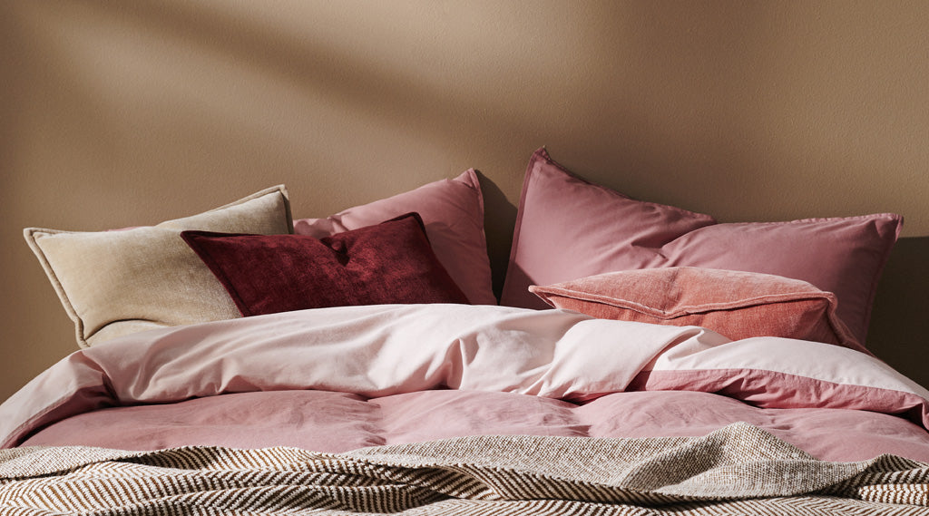 Weave Nova velvet cushion collection on bed