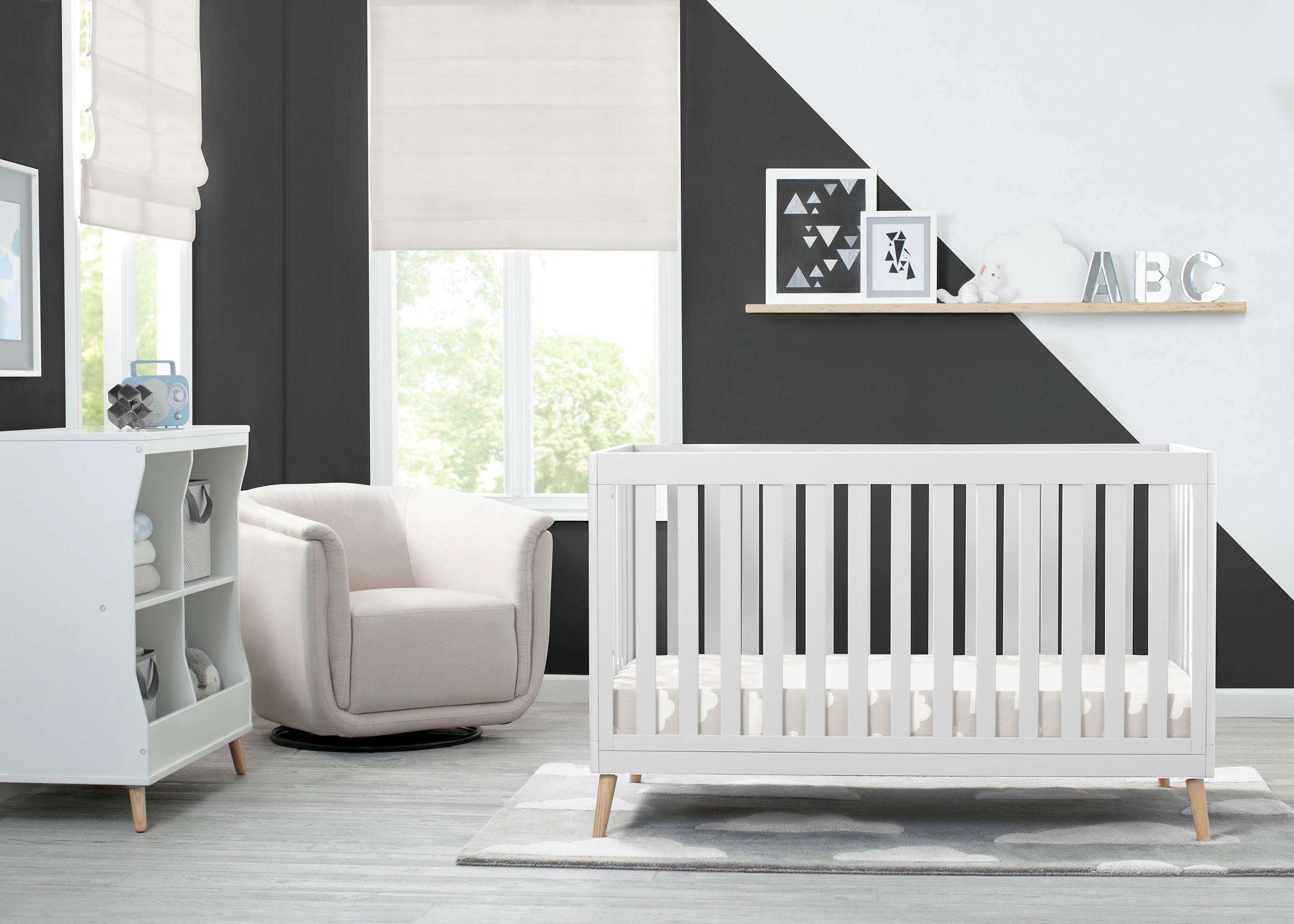 white crib with wood legs