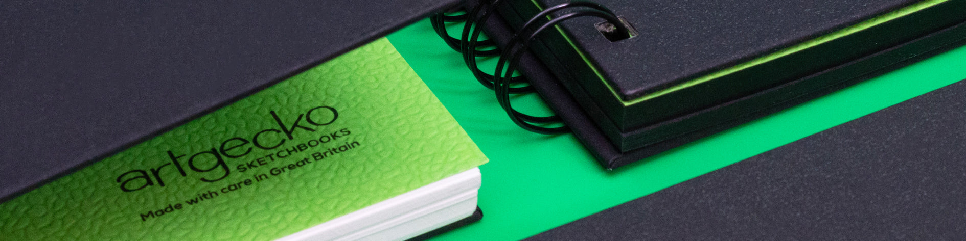 The textured green protective sheet within an Artgecko Sketchbook