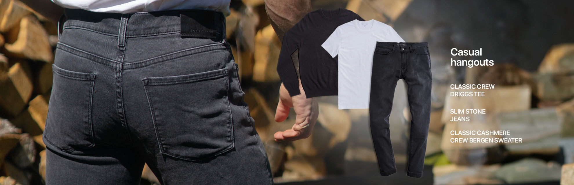 Une tenue pour les sorties décontractées composée d'un pull en cachemire noir, d'un t-shirt blanc et d'un jean gris foncé.