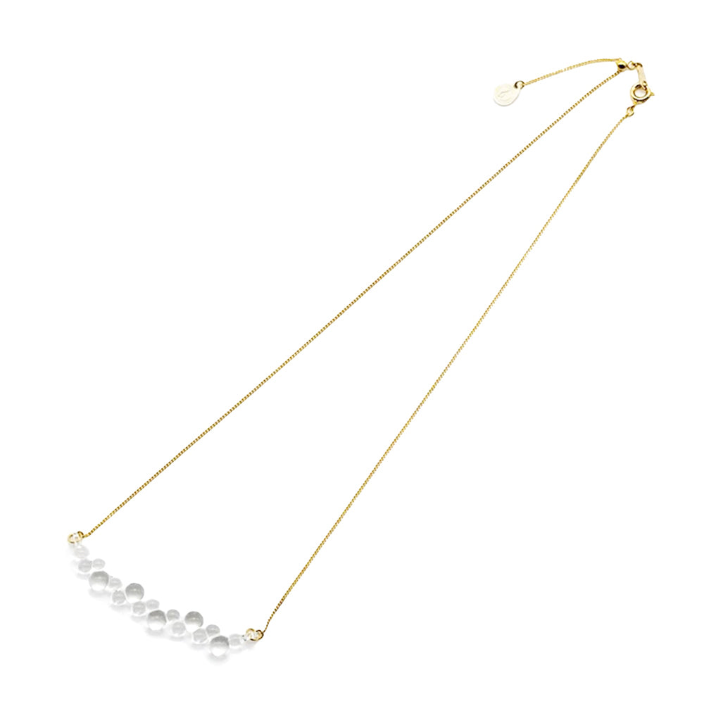 https://cdn.shopify.com/s/files/1/0578/8155/9218/files/gloss-water-drops-necklace1_1000x_1ca8385f-5471-45ab-80db-e130a7d73abd.jpg?v=1691432544&width=1600