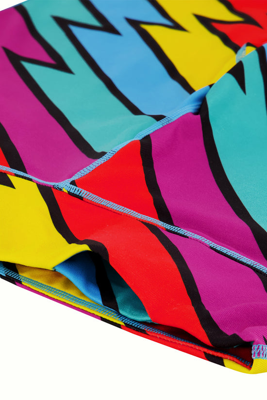 Brightly colored leggings with a thunderbolt pattern detail shot