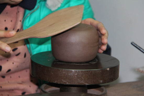 Mr Ge's daughter making a fully handmade Yixing teapot in their studio. #familybusiness