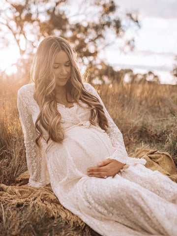 white flowy maternity dress perfect for maternity photoshoots, baby showers and family photos.