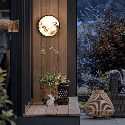 Our Garden Moon Light overlooking an outdoor dining table.