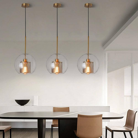 Glass Loft Pendant Lights hanging above table