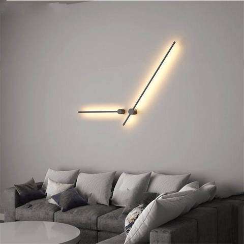 Two Nordic LED Pole Lights on living room wall above grey corner sofa