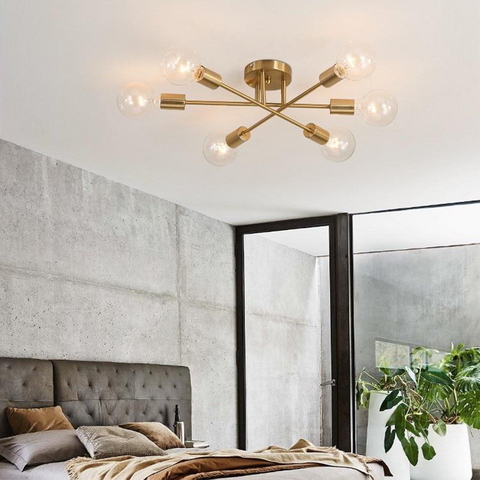 Modern Exposed Chandelier above bed in bedroom