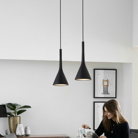 Two black Nordic Hanging Pendant Lights hanging above dining room table