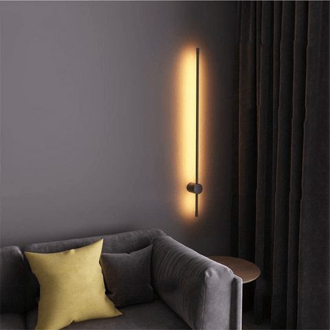 Nordic LED Pole Light above coffee table and grey sofa in living room