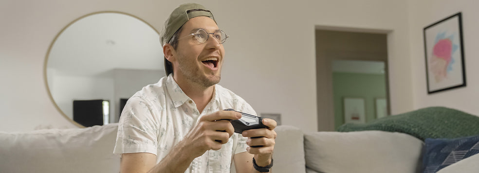 Man playing video games while wearing Brooklyn Blue Light Blockers