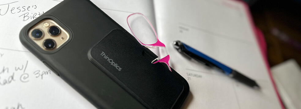 Pink Readers + Universal Pod on the back of a mobile phone