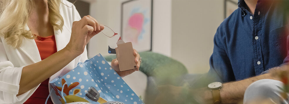 Woman opening her gift of a ThinOptics Flashcard Wallet