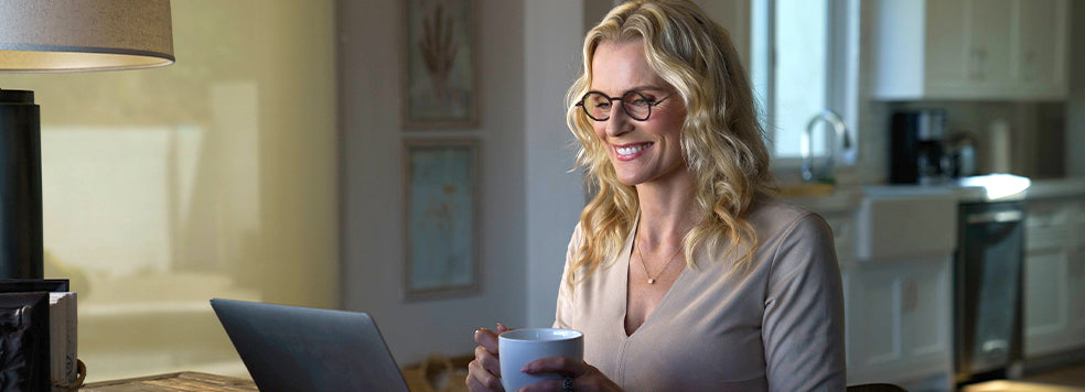 Woman working on her laptop wearing Manhattan Blue Light Blocking Reading Glasses