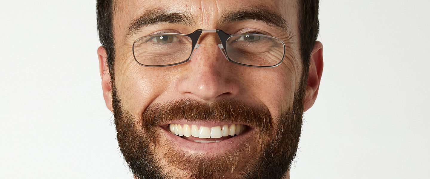 Man smiling wearing ThinOptics Headline Readers