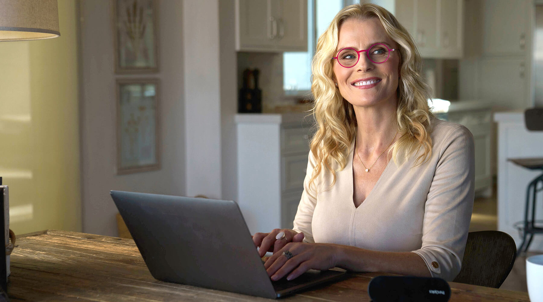 Woman wearing Manhattan Reading Glasses while working on a laptop