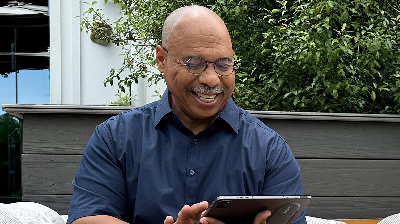 Man wearing Manhattan Reading Glasses while looking at a tablet