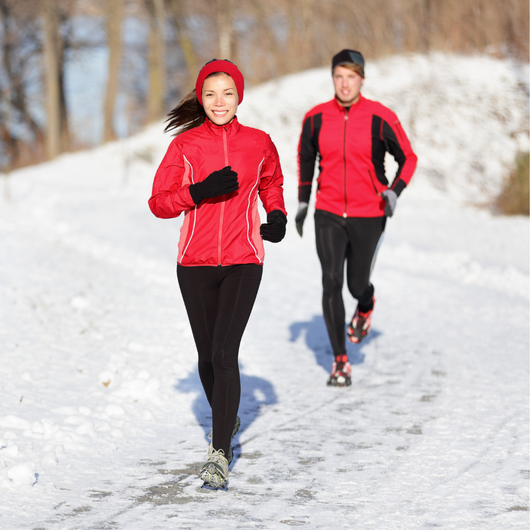 people jogging in the winter snow