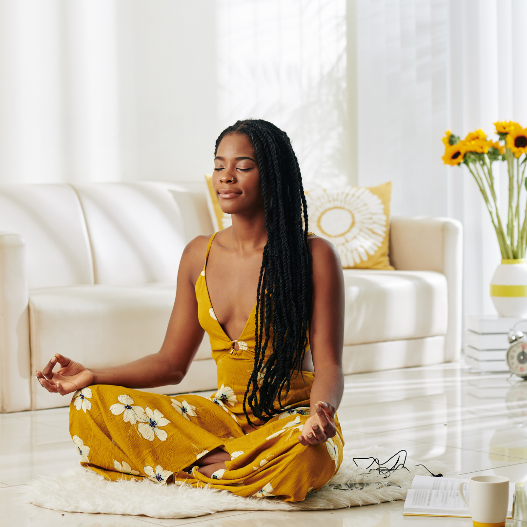 woman meditating in living room