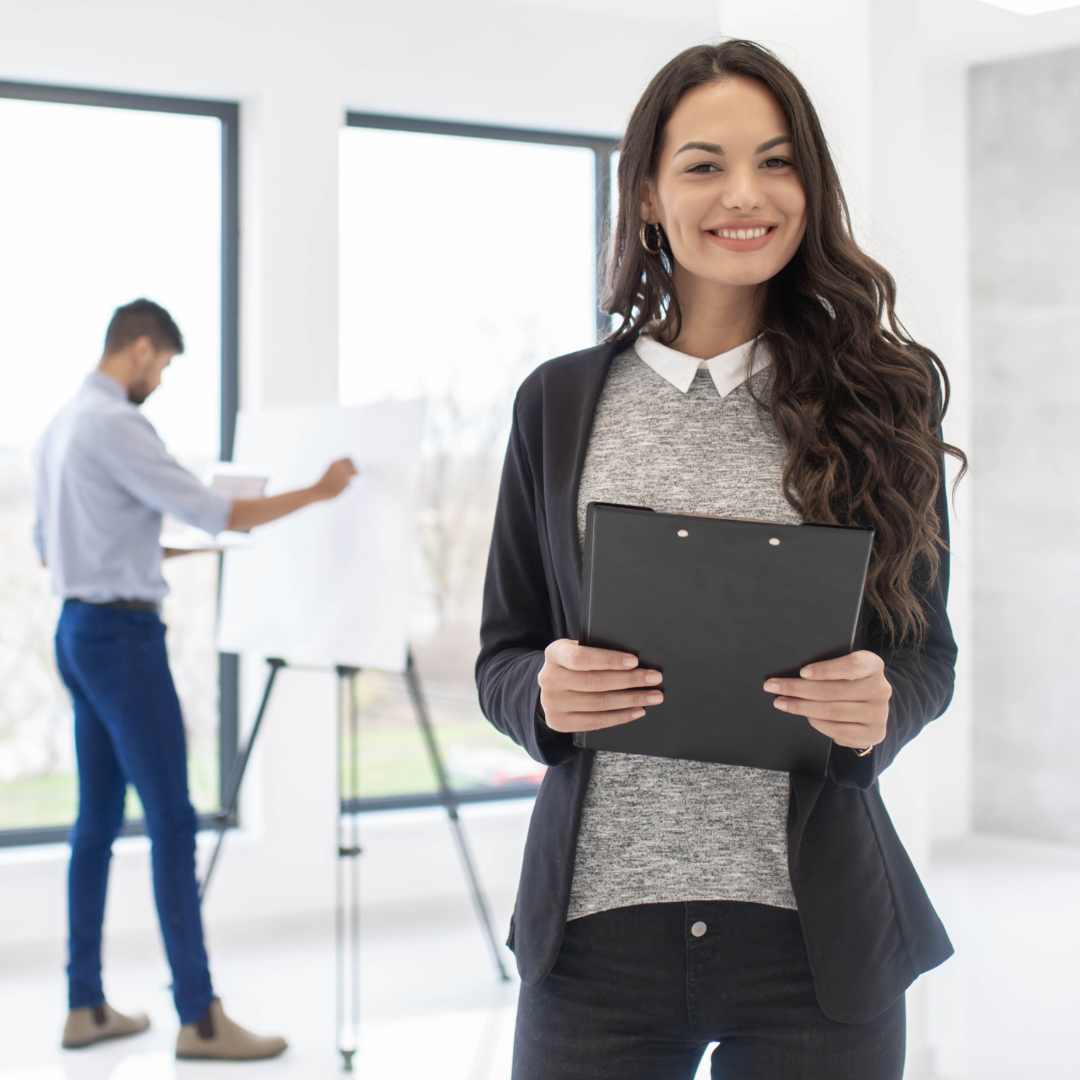 happy confident business woman with clipboard