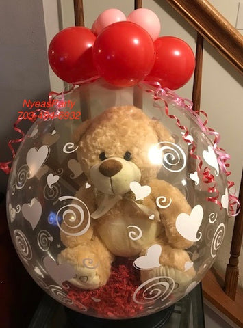 balloons with teddy bear inside