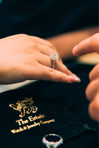 jeweler inspecting diamond ring