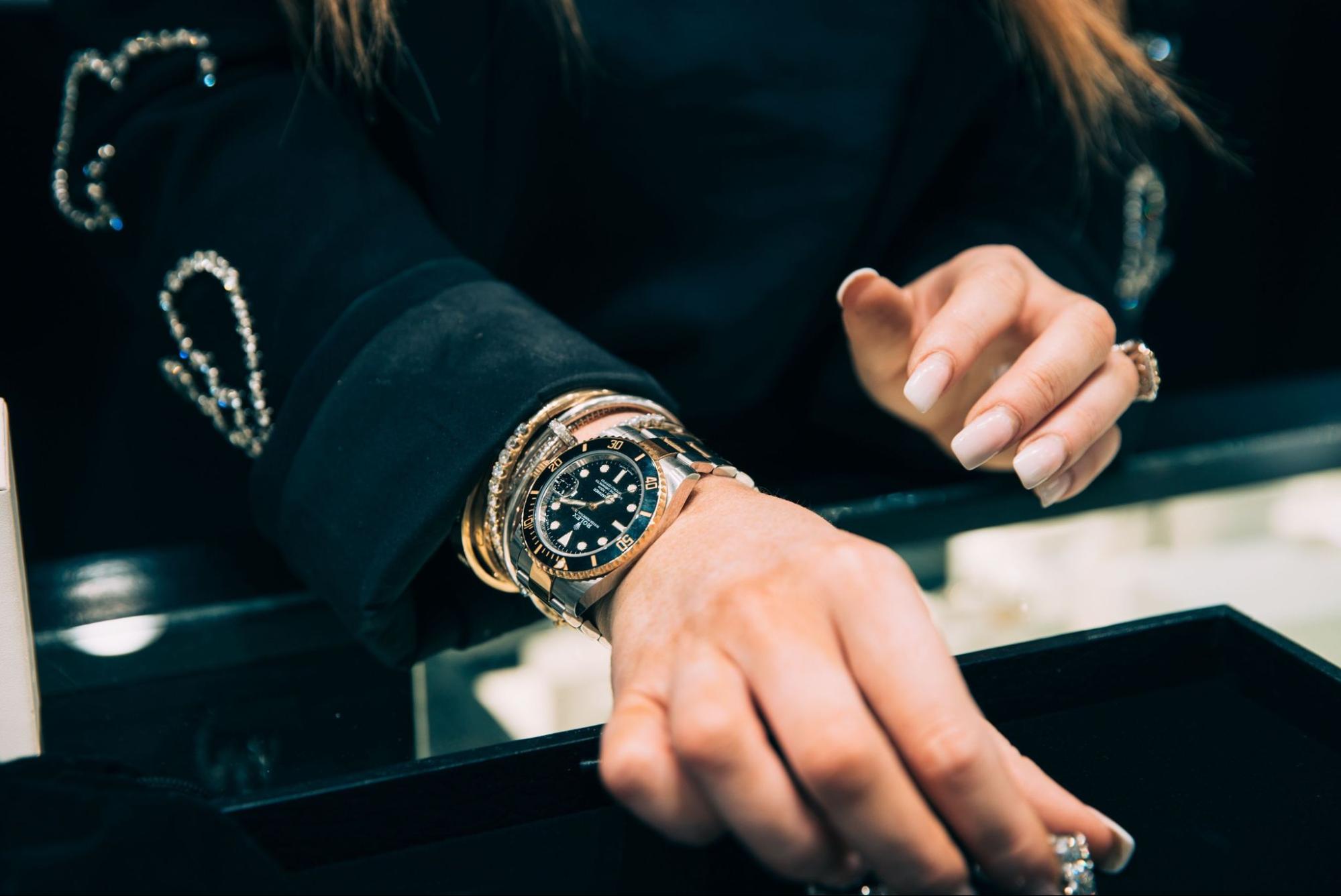 woman wearing Rolex watch