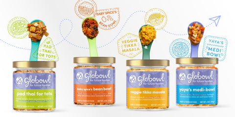 Four jars of Globowl baby food jars with labels and spoons popping out of them with food on them