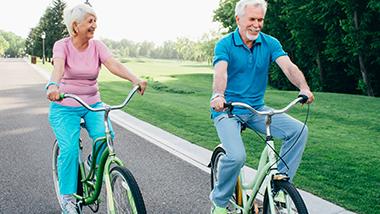 Happy couple riding bikes. What Makes Rose-Hip Vital So Special. 