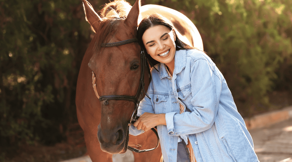 girl hugging her horse