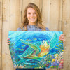 Colorful sea turtle canvas poster art inspired by Florida coastal living. Featuring a vibrant coral reef filled with reef fish and other Caribbean ocean animals discovered while scuba diving Florida.