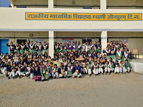 Group of girls in rural India holding Spirit Sanitary Pads