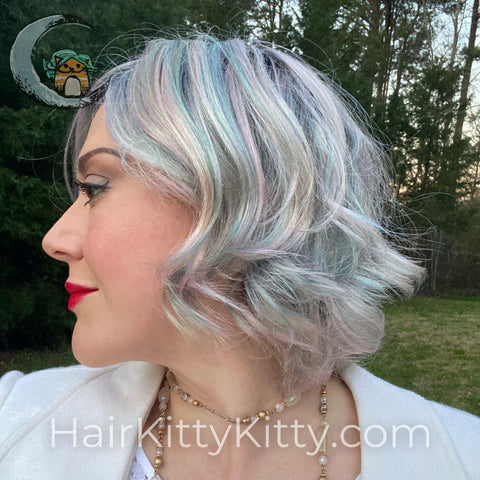 Our Mermaid Kisses Rooted has an ashy rainbow of pink, blue, white, yellow, and green that come together to make a fashion grey optical illusion!