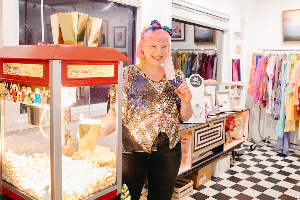 Aly dishing up bottomless fresh popcorn at the Fairy Floss Fantasy exhibition opening.