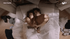 couple taking pictures in bed gif