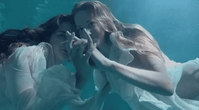 two women underwater gif