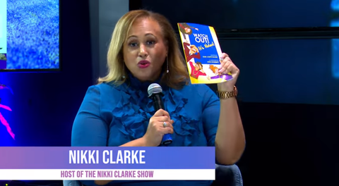 Nikki Clarke Holding Dark Joseph Ravine's Book