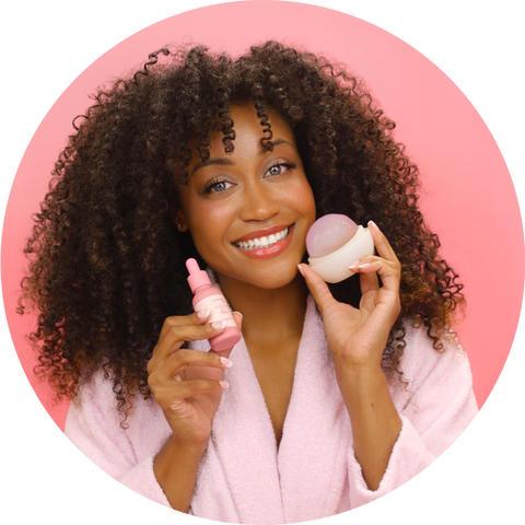 African-American Girl holding an Ice Face Baby Ageless Ball and Ageless Oil