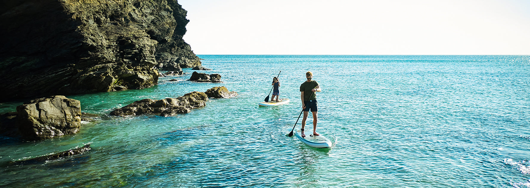 Man and women SUP on the ocean