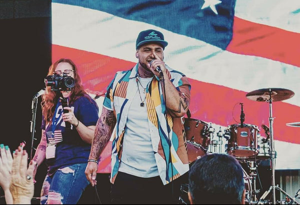 Coaster performing on stage in front of a crowd