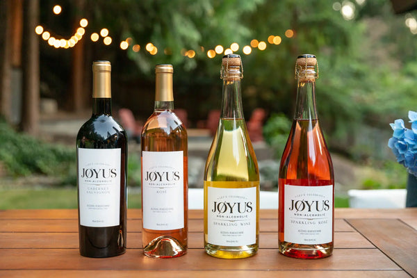 Four bottles of Joyus non-alcoholic wine Cabernet Sauvignon Sparkling Rosé Rosé Sparkling Wine