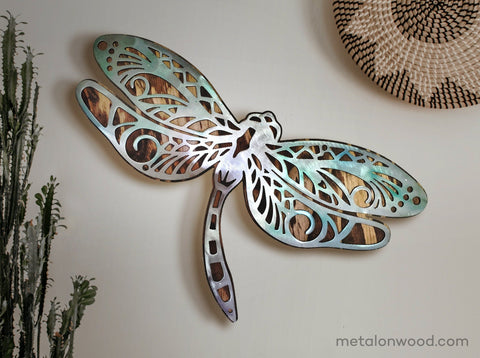 Dragonfly metal on rustic wood background