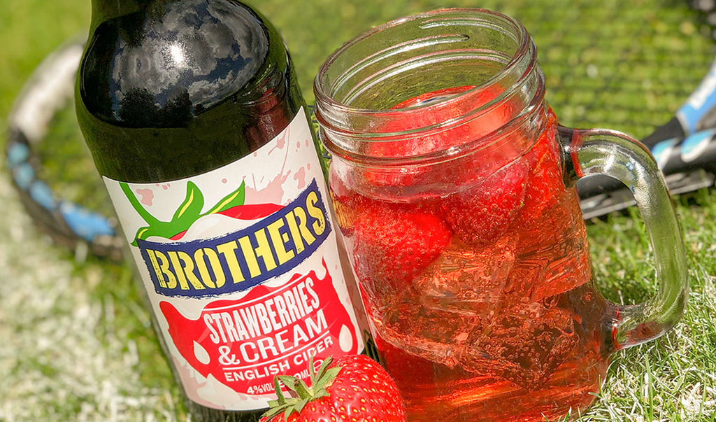 Brothers Strawberries & Cream cider on a tennis court