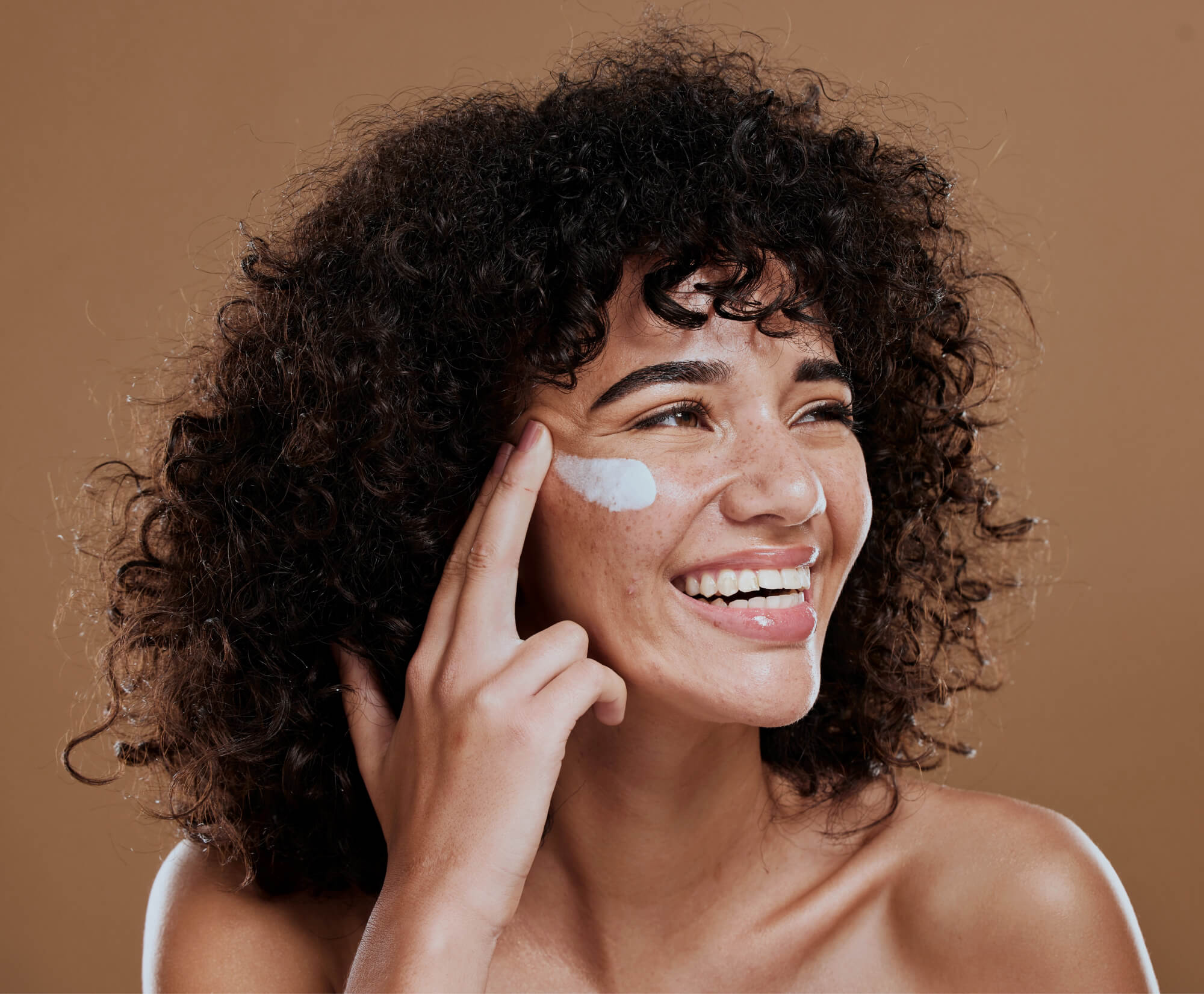 Woman applying skincare