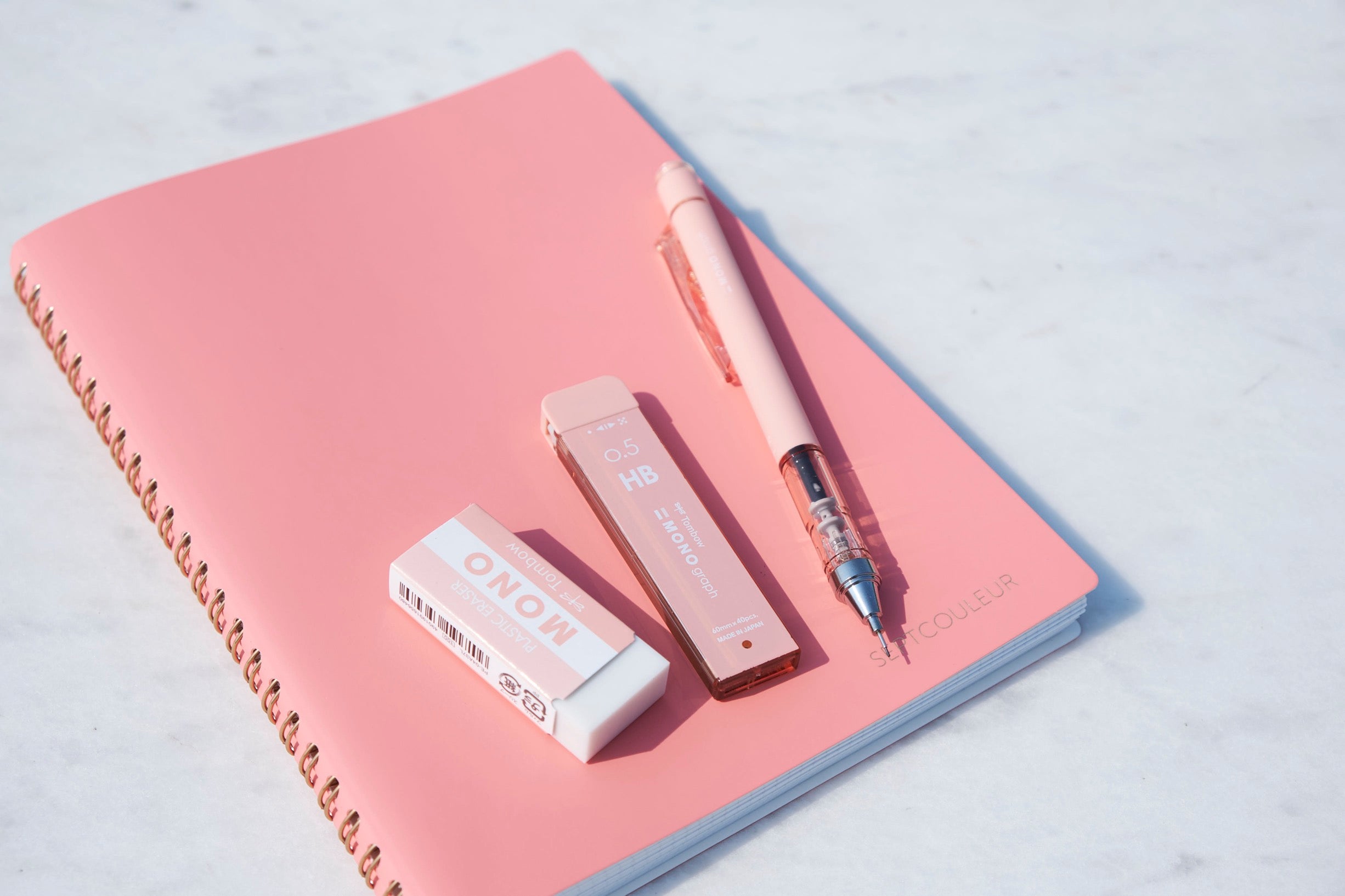 a collection of pink japanese stationery